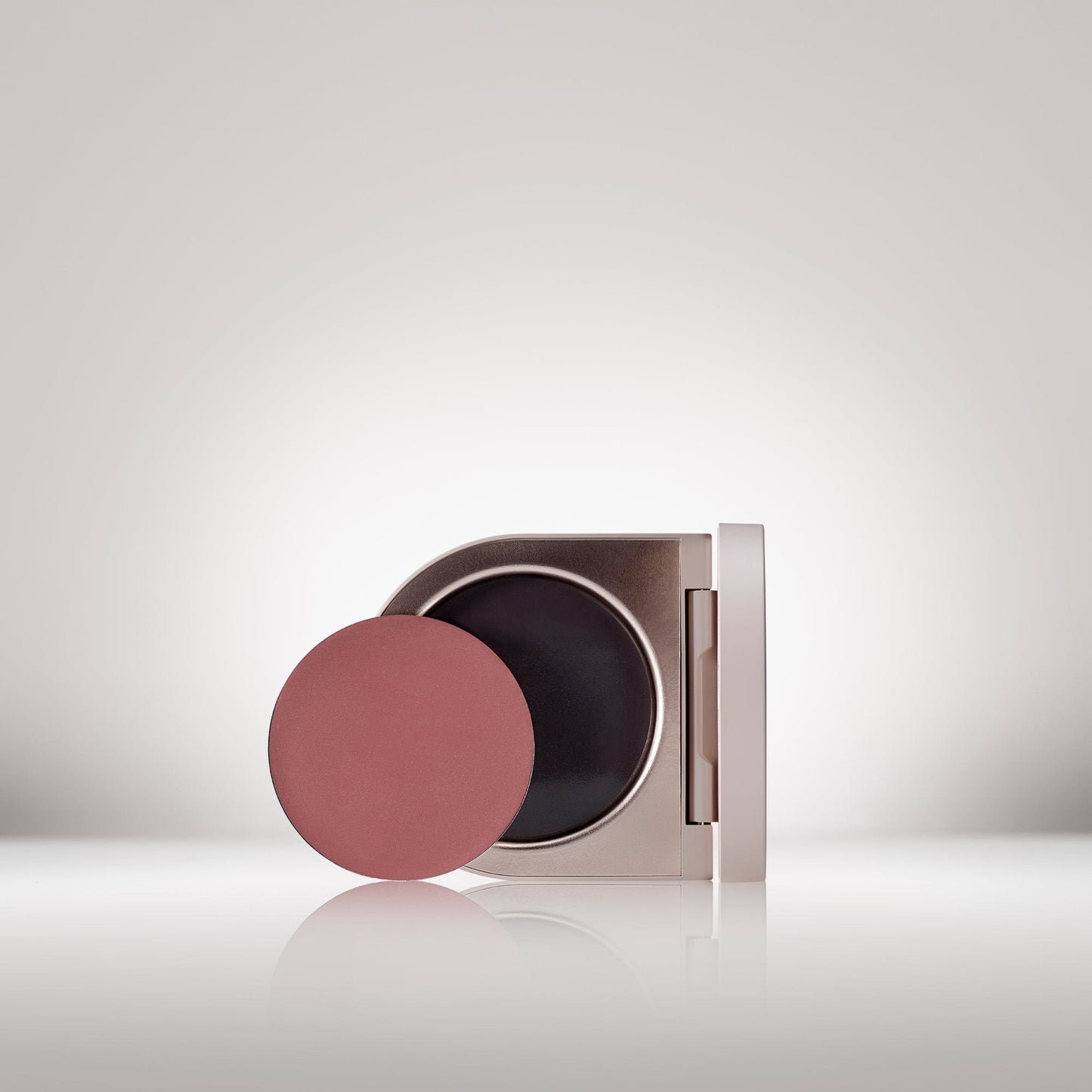 Image of the Cream Blush Refillable Cheek & Lip Color in Camellia in front of the open compact - Cream blush