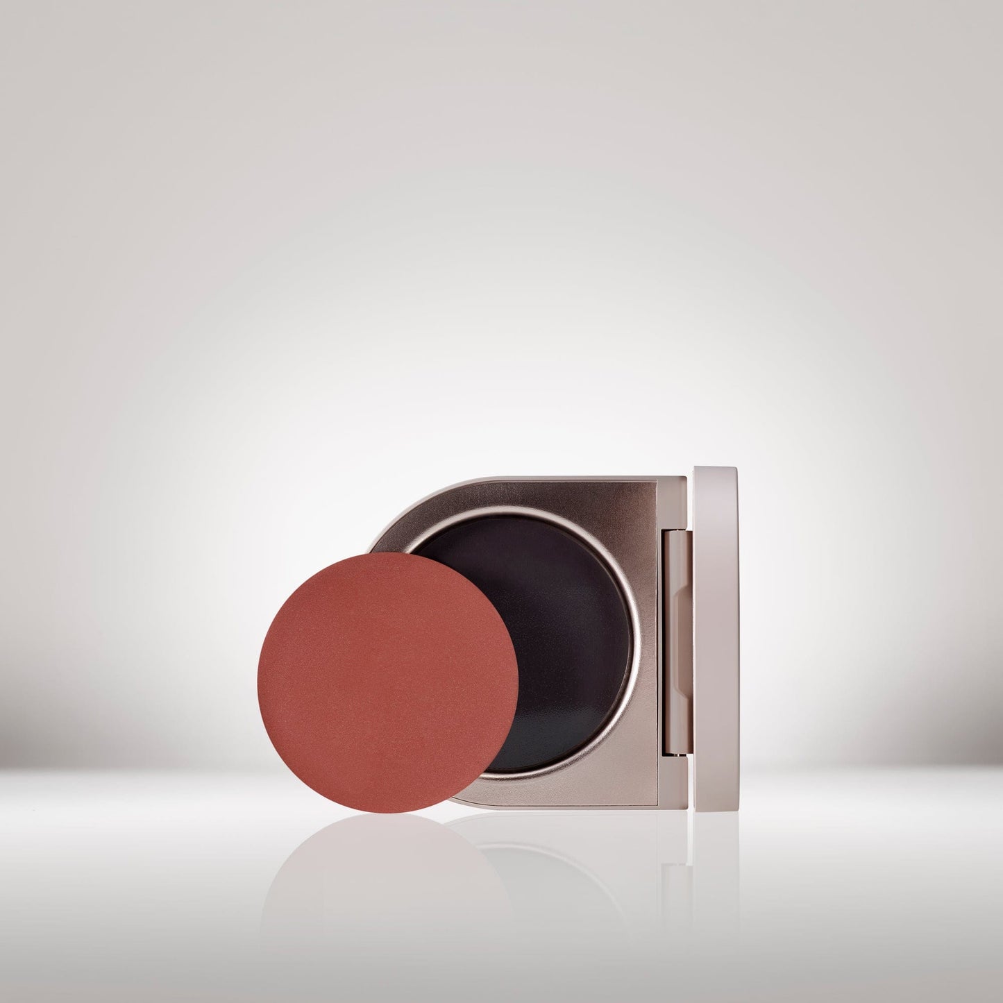 Image of the Cream Blush Refillable Cheek & Lip Color in Foxglove in front of the open compact- Cream blush