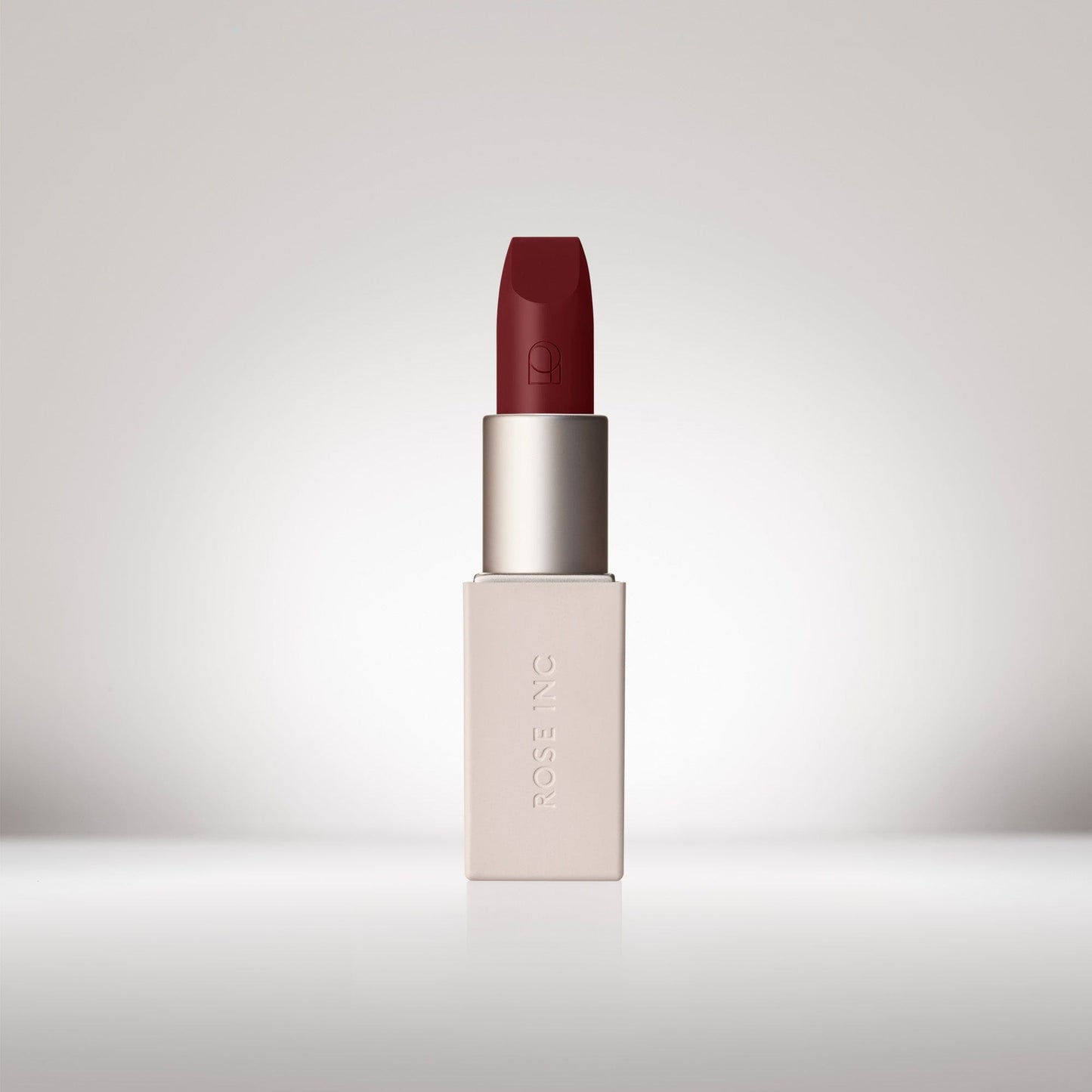 Image of an opened Satin Lip Color Rich Refillable Lipstick in shade Poised